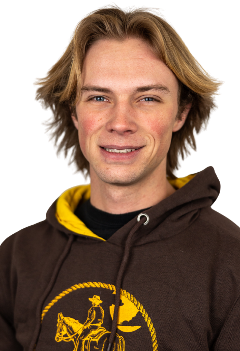 Cowboy Coach Orion Cottam poses for a photo