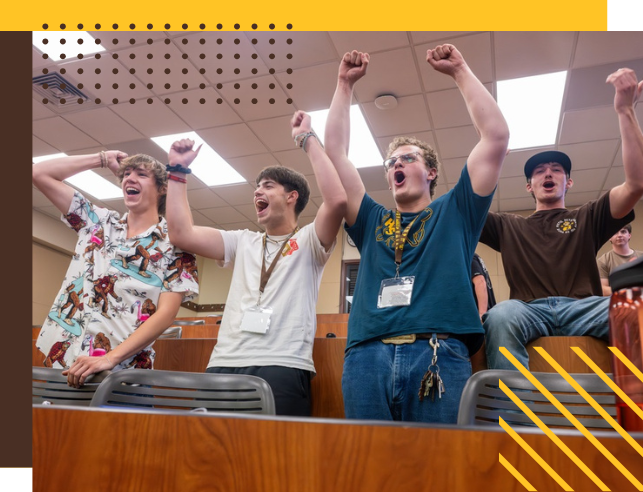 Students celebrate something in classroom