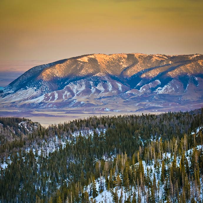 A snowy mountain at sunrise