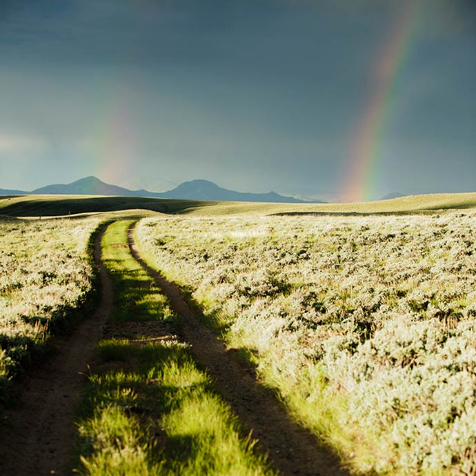 A rainbow against the mountains after a rain storm