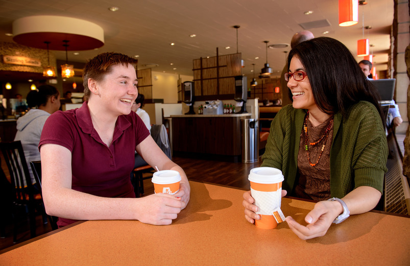 Professor and student meet in a cafe