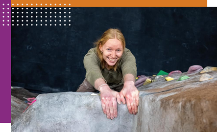 A UW student climbs the rock wall at Half Acre