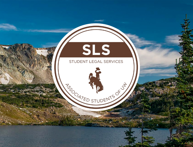 Student Legal Services logo over teh Snowy Range Mountains and lake