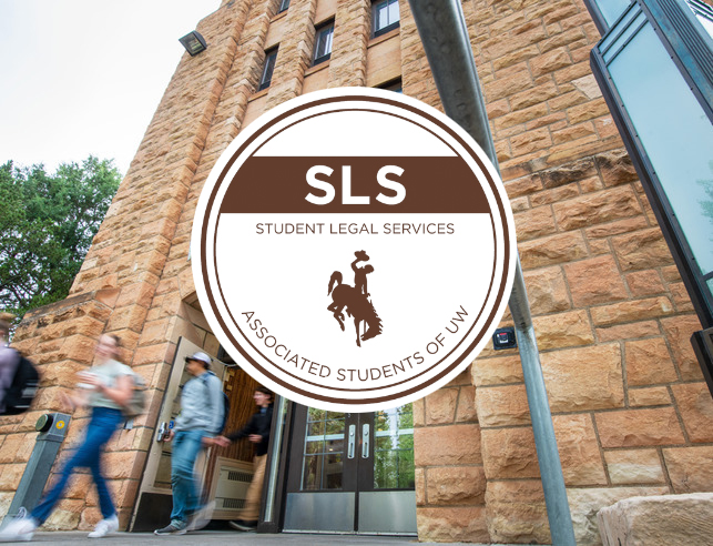 Students walking out of the Union with the Student Legal Services logo on top