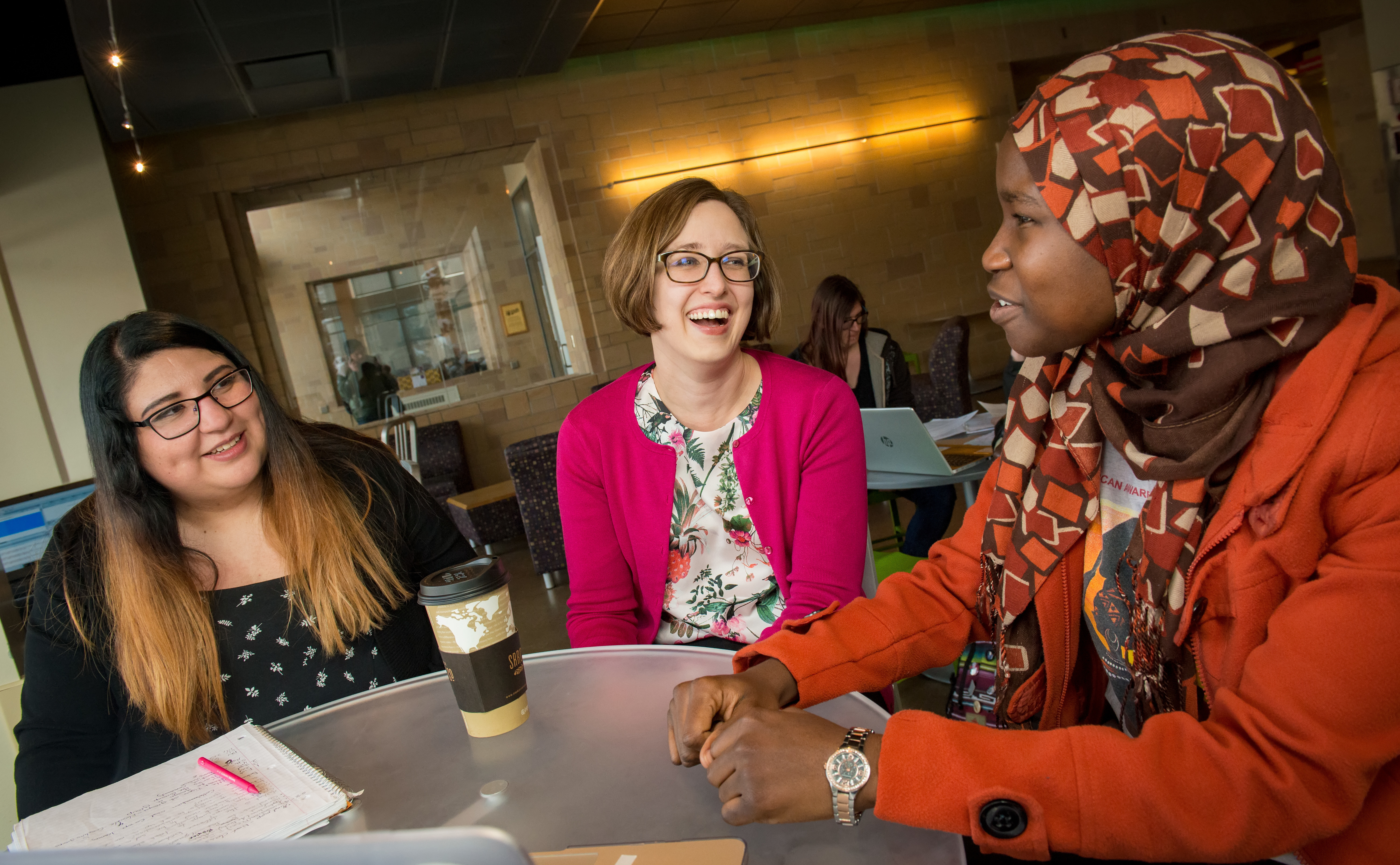 students meeting with staff