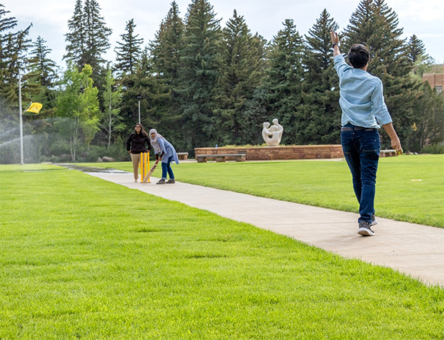 UW students playing cricket in Prexy's Pasture at the University of Wyoming