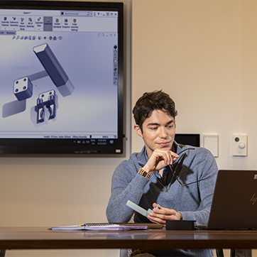 Student looking at a computer