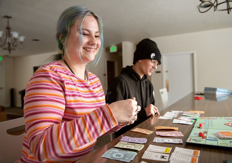 Two students play monopoly.