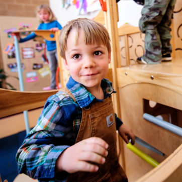 child in carhartt overalls