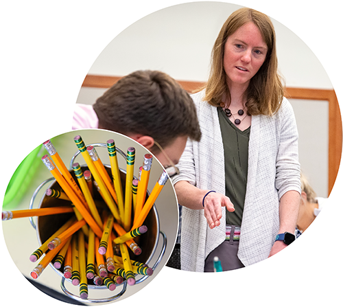 teacher with student and pencils 