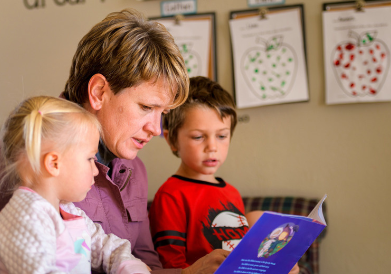 UW's Nikki Baldwin reading to children