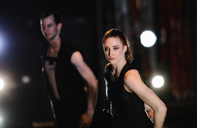 photo of two dancers in black