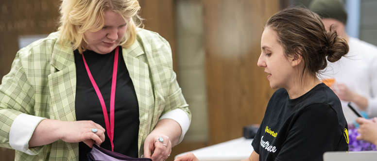 Costume faculty working with a student