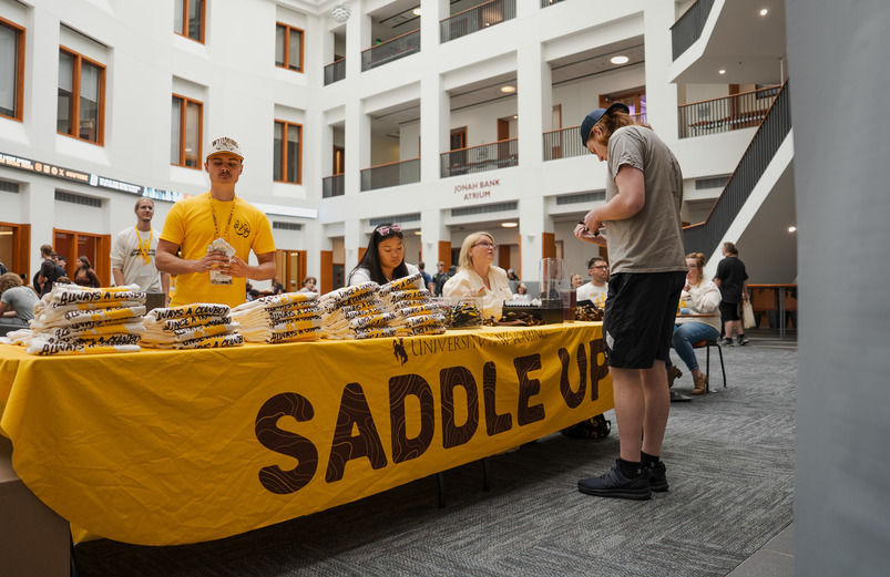 Student check in at saddle up