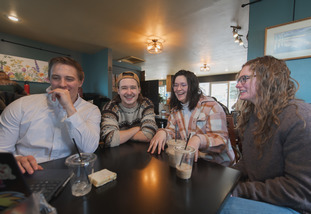 UW students enjoy time working together at a cafe near campus.