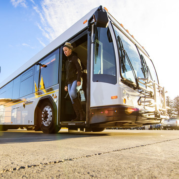 Passenger leaving a UWYO Roundup Bus