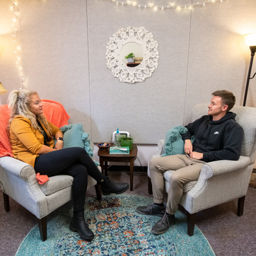 A UW student and a counselor from the University Counseling Center talk together during an individual counseling session.