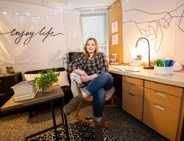 Student sitting in dorm room