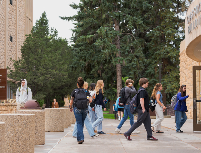 Students walking into the Classroom Building