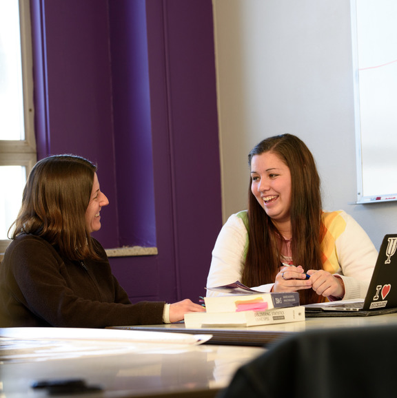Student chatting with an advisor 