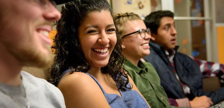 Students laughing together in dorm common rooms
