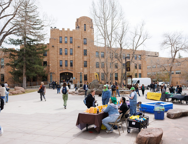People sitting at booths outside the Union