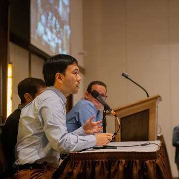 Male presenting with microphone