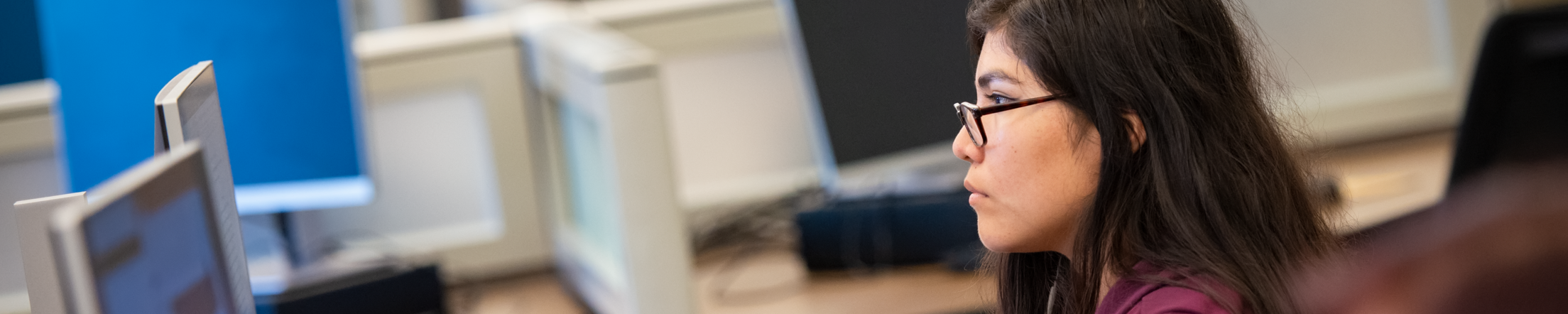 student sitting at a computer