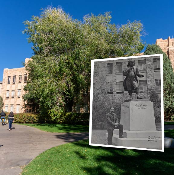 Sculptor Robert Russian poses by his statue of Benjamin Franklin in 1958 in front current day A&S 