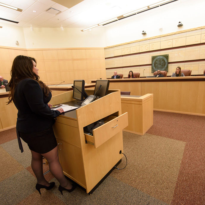 Student practicing in practice court