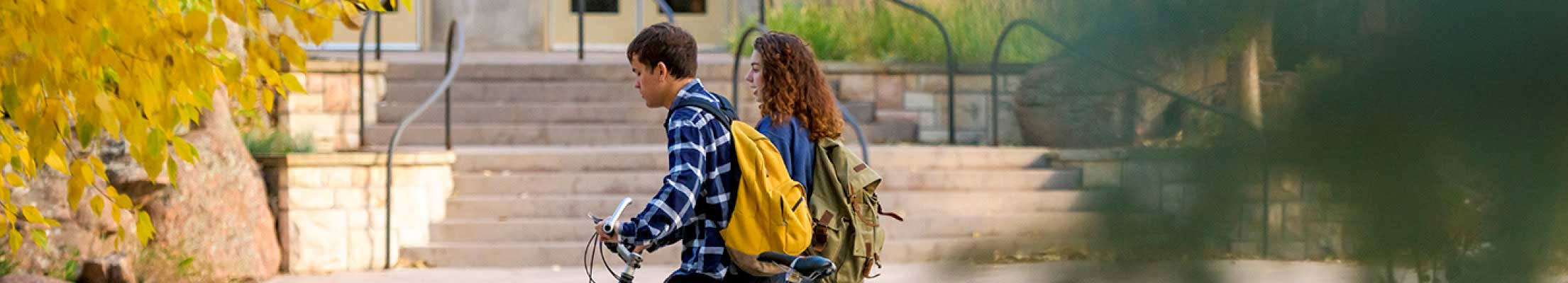 Two students walking on campus