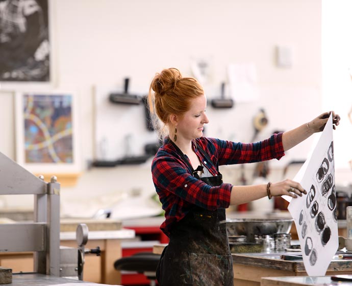 finearts building woman making a print