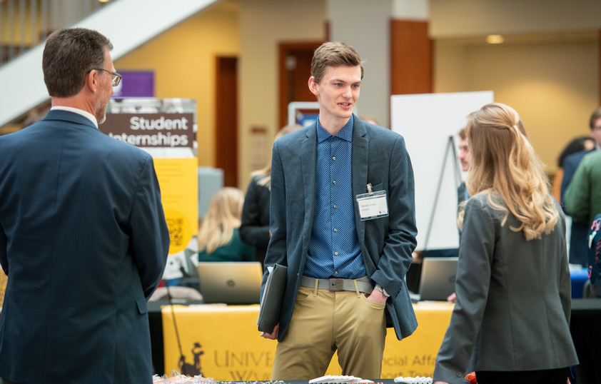 Student talking with businesses at Career Fair