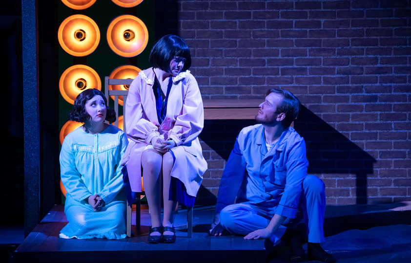 Three student actors performing a scene