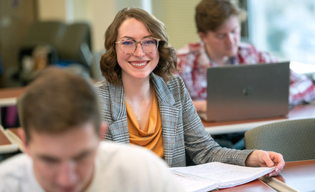 Student smiles in class.