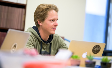 Student works on laptop.