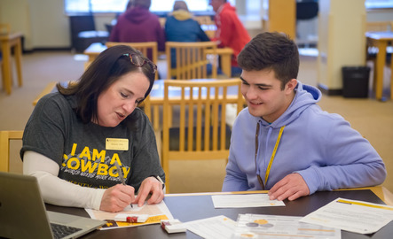 Student talking to admissions faculty