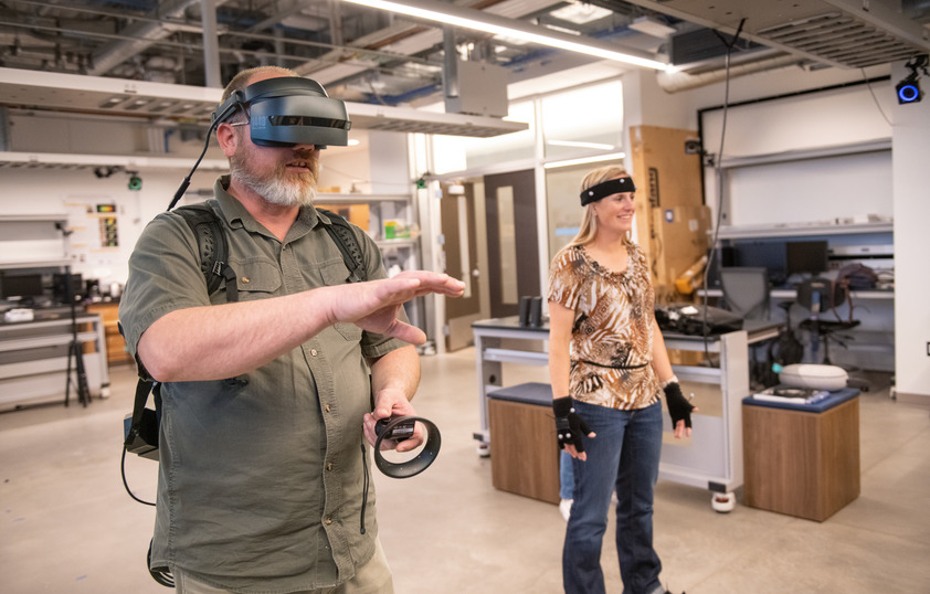 Two students working with virtual reality add-ons