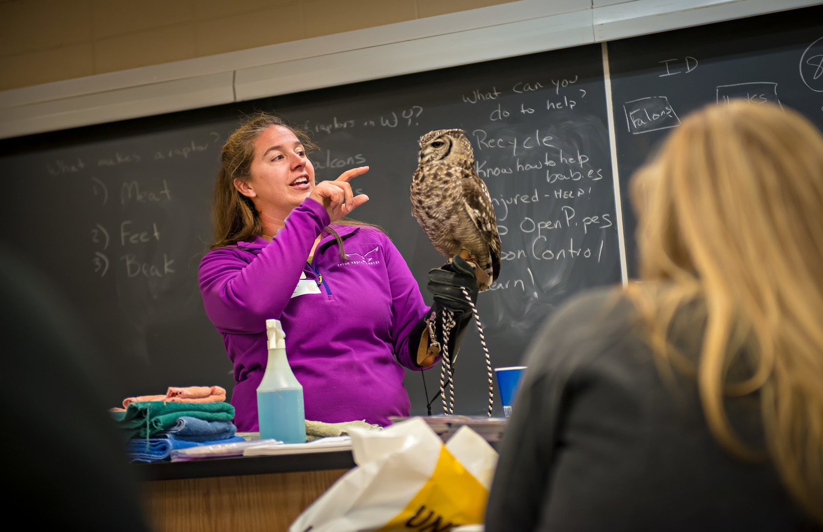Professor holding owl in class