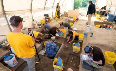 Students and faculty members out in the field