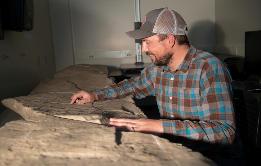 Student examining rock fixtures