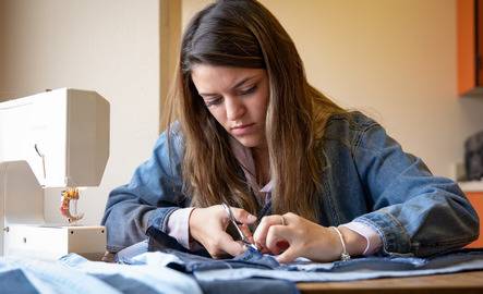 Fashion student cuts denim