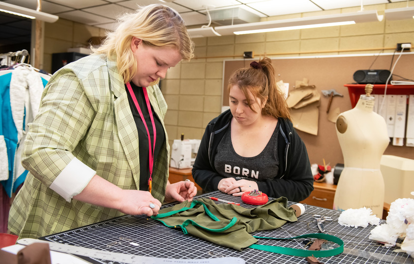 Two students in a clothing design class