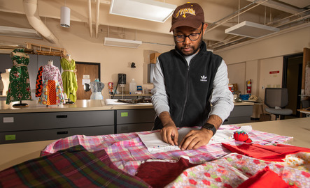 A student sews in a lab