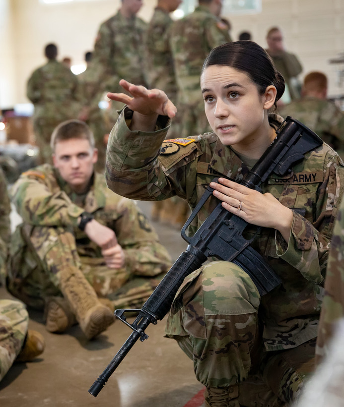 Student guiding other students through training