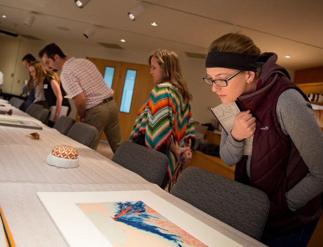 Students studying art objects