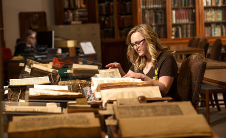 Student looking through old scripts