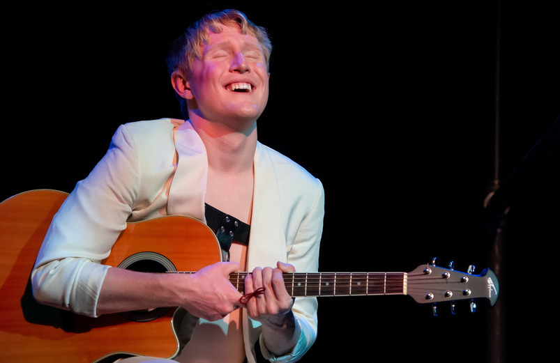 Student playing guitar