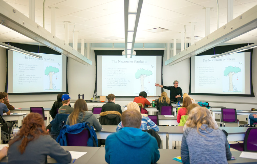 A professor teaches a classroom full