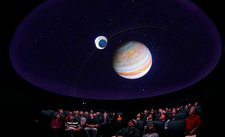 People viewing show in planetarium